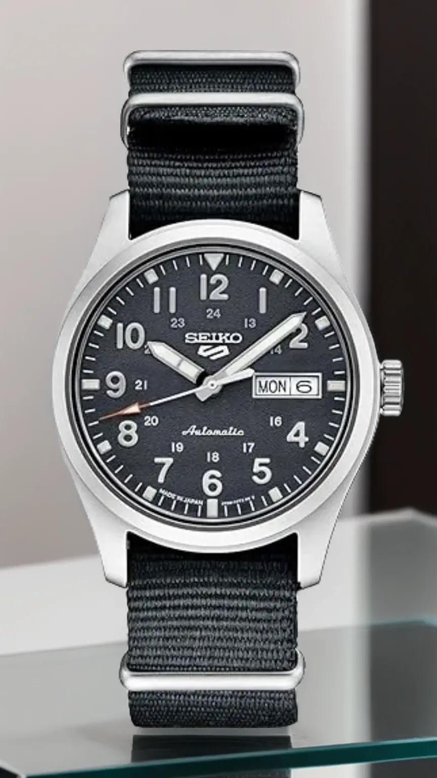Man wearing a Seiko 5 Sports watch, an example of affordable men's watches. Best budget watches, stylish timepiece, Seiko watch for men.