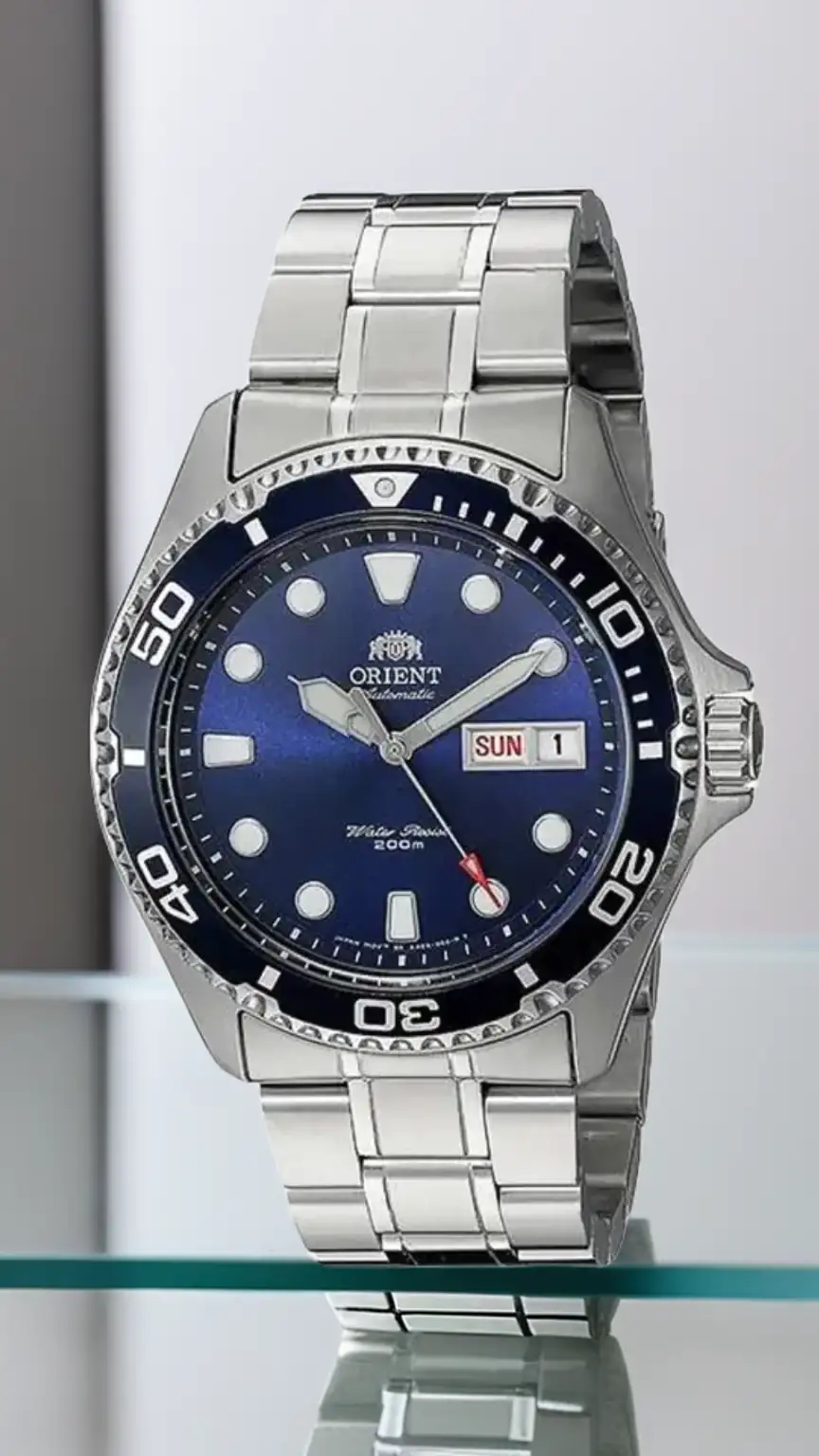Man wearing an Orient Ray II automatic watch, showcasing a sleek mid-range option. Best automatic watches, Orient watches for men, dive watch style.